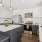 a kitchen with grey cabinets