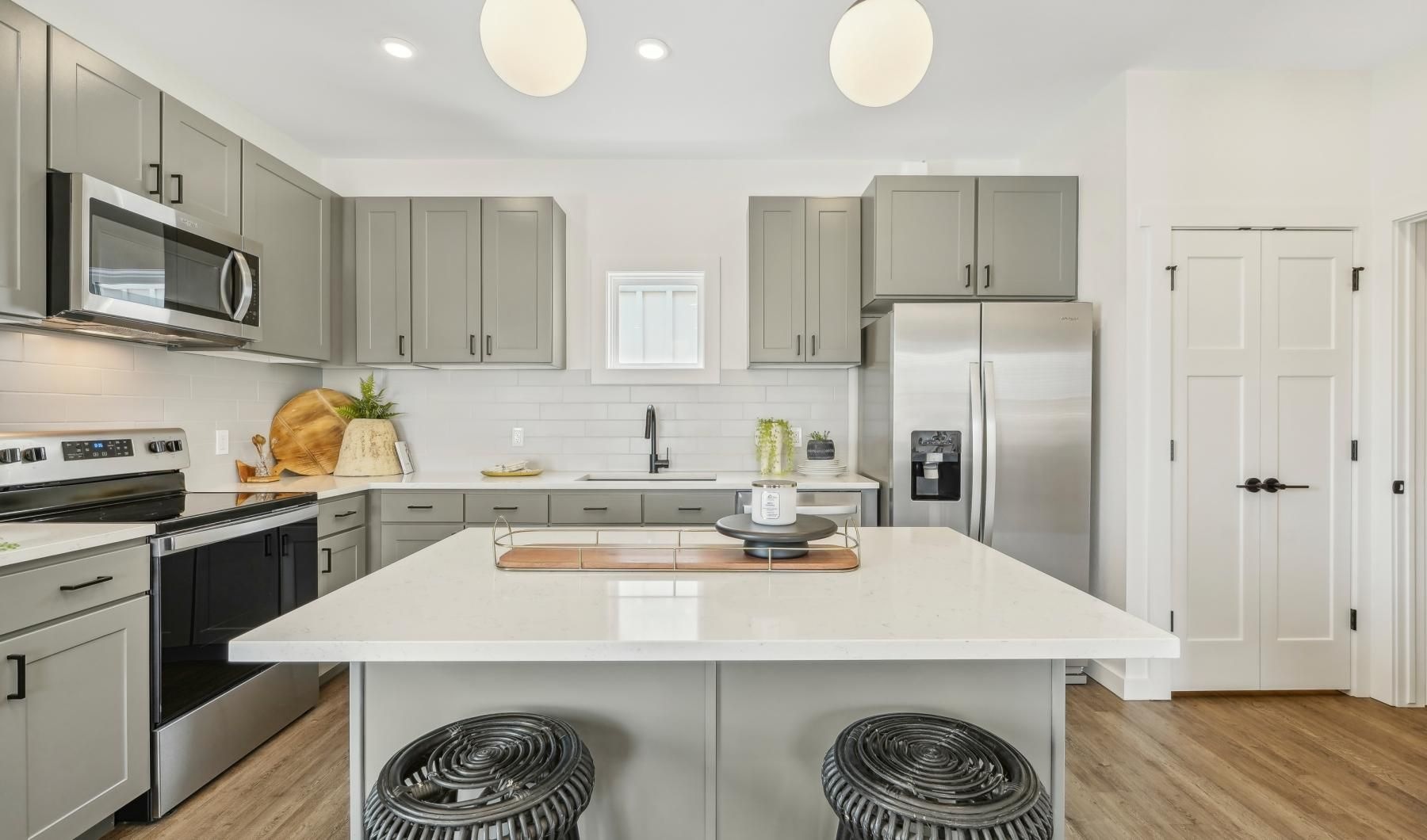 a kitchen with white cabinets