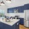 a kitchen with blue cabinets