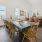 a dining room with a table and chairs