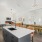 resident kitchen with a bar and chairs