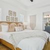 Bedroom with lamps on nightstands and a window