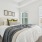 a bedroom with a bed and a lamp