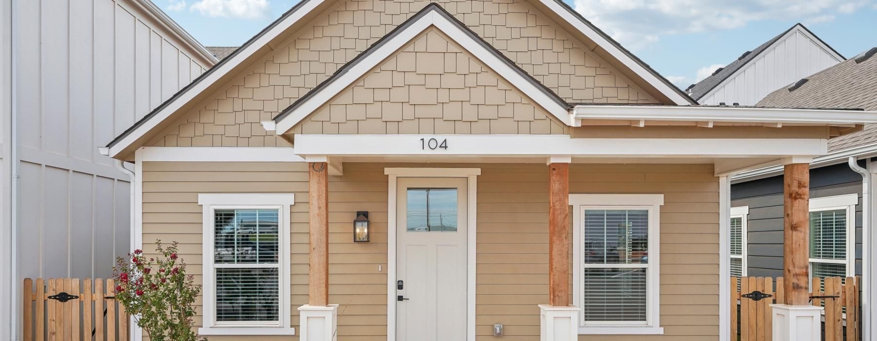 a house with front porch and white door