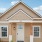 a house with front porch and white door