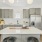 a kitchen with white cabinets