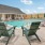 a swimming pool and chairs outside a building