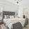 a bedroom with a bed and a fan